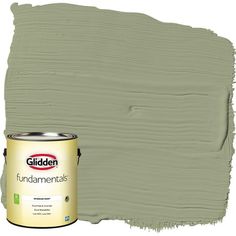 a green paint with the words golden on it and a can of paint next to it