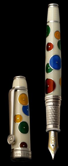 a fountain pen with multicolored dots on it