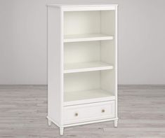 a white bookcase with two drawers on the bottom and one drawer in the middle