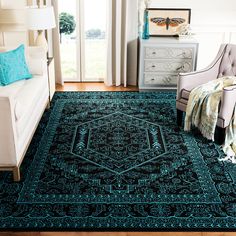 a living room with a blue rug on the floor