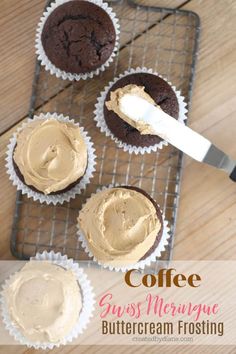 coffee cupcakes with frosting on a cooling rack and a spatula next to them