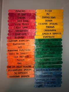 several different colored sticks with names on them