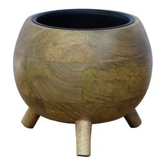 a wooden pot sitting on top of a table