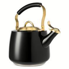 a black and gold tea pot with a handle on the side, isolated against a white background