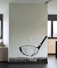 a living room with a wall sticker depicting a golf club and ball