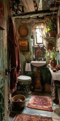 an old fashioned bathroom with rugs, sink and toilet in the middle of it