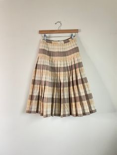 This skirt was my grandmothers and was later worn by my mother. Features a side zip. Label: In'n Outer by Sportrite Material not listed, feels like wool or a wool blend Size: fits 24in waist, refer to measurements Excellent Vintage Condition, one small mark see last photo.  MEASUREMENTS IN INCHES (laid flat + unstretched double where needed) : Waist: 12 Hip: 20 Length: 27 Each vintage piece has been preloved. Minor fading + wear is expected & often adds to the character. All items are cleaned & from a smoke & pet free building. We hope you appreciate this find as much as we do. Vintage Full Skirt With Lining, Vintage Pleated Mini Skirt, Fitted Vintage Mini Skirt, Vintage Accordion Pleats Skirt For Spring, Spring Vintage Skirt With Accordion Pleats, Spring Vintage Accordion Pleats Skirt, Vintage Pleated Cotton Skirt, Vintage Cotton Pleated Skirt, Vintage Lined Skirt For Fall