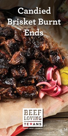 a bunch of food that is on top of a paper bag with the words candied brisket burnt ends