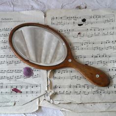 a magnifying glass sitting on top of sheet music