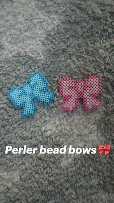 two perler bead bows are laying on the floor