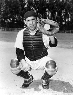 an old black and white photo of a baseball player holding a catchers mitt