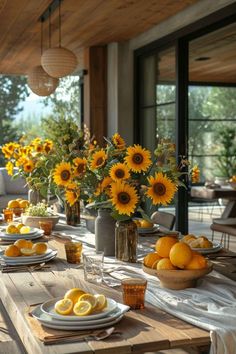 the table is set with sunflowers and lemons