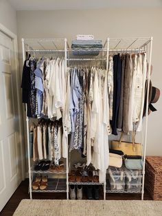 an organized closet with clothes and shoes