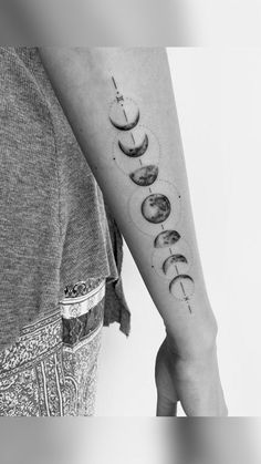 a woman's arm with phases on it