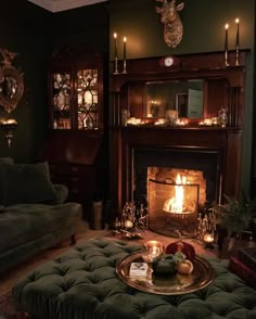 a living room filled with furniture and a fire place in the middle of the room