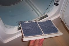 a person is holding something in front of a bathtub that has been cleaned and sealed