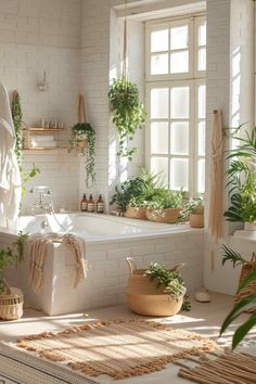 a white bathroom with plants in the tub and towels on the wall, along with potted plants