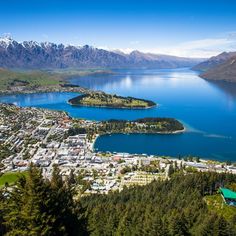 an aerial view of the town of queenstown and lake wakatu in new zealand