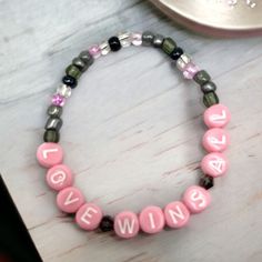 Love Wins All by IU and V of BTS beaded bracelet. Inspired by the single cover, the bracelet is designed in shades of grey and pink.  Please keep in mind that colors may appear different due to individual screen settings. Personalized Pink Kpop Style Jewelry, Pink Beaded Kpop Bracelets, Pink Kpop Beaded Bracelets, Kpop Pink Beaded Bracelets, V Of Bts, Bts Accessories, Bracelet Inspired, Love Wins, Bracelet Design