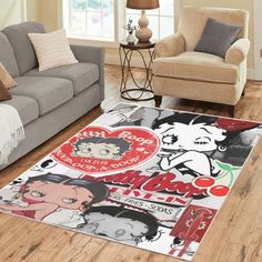 a living room with two couches and a rug that has cartoon characters on it