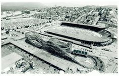 an aerial view of a soccer stadium and surrounding buildings