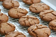 chocolate cookies are cooling on a wire rack