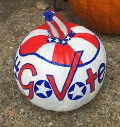 a painted pumpkin with an american flag on it