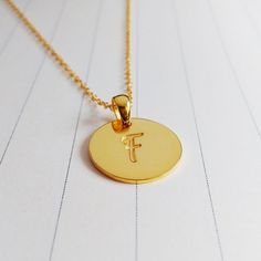 All of our products are handmade.A beautiful handmade 0.75" inch gold monogram necklace, you can choose any 1-3 initials.Necklace is Engraved - Not Stamped.The custom name disc necklace is made out of 925 sterling silver,it measures about 0.75",1.2mm thickness.The length of sterling silver chain can be selected in 14",16",18",20" or 22".You can have it done in sterling silver,18k gold plated,white gold plated.Please leave the text you would like to be engraved in the -notes to seller- section.In Minimalist Gold Jewelry For Personal Use, Gold Name Necklace With Round Pendant, Engraved Medallion Initial Necklace As Gift, Engraved Medallion Initial Necklace Gift, Personalized Gold Necklaces For Personal Use, Personalized Pendant Necklaces For Personal Use, Personalized Gold Necklace For Personal Use, Personalized Pendant Necklace For Personal Use, Customizable Gold Round Disc Charm Necklaces