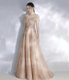 Embellished Tulle Evening Dress Floor-length, Floor-length Embellished Tulle Evening Dress, Champagne Tulle Prom Gown, Elegant Floor-length Glitter Tulle Gown, Elegant Floor-length Gown In Glitter Tulle, Fitted Floor-length Evening Dress In Glitter Tulle, Glitter Tulle Ball Gown For Evening, Elegant Prom Gown In Glitter Tulle, Evening Tulle Ball Gown With Sequins