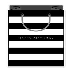 a black and white shopping bag with the words happy birthday on it's front