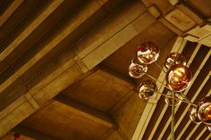 a chandelier hanging from the ceiling in a room