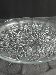 a glass platter with flowers on it