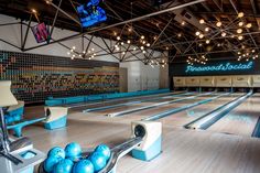 the bowling alley is empty and ready to be used for games or other activities,