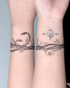 two wrist tattoos with barbed wire on them