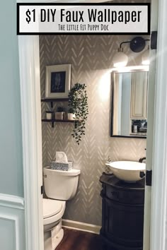 a bathroom with a toilet, sink and mirror