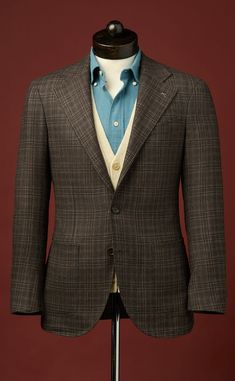 This handsome sport coat uses an elegant blend of silk and wool from Di Pray in a classic brown check, with accents of tan and teal. Styled in our signature Neo Cut, details include unpadded shoulders, wide notch lapels, and a 3-roll-2 button closure. An incredibly versatile year-round jacket, you can dress it up with a shirt and trousers, or dress it down with a turtleneck sweater and jeans.