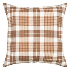 a brown and white plaid pillow on a white background