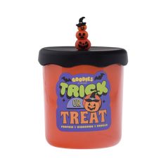 a trick or treat jar with two pumpkins on top