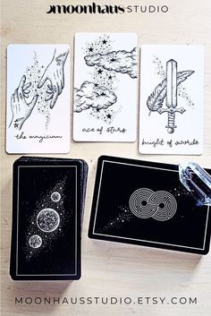 four cards with different designs on them and the words moondusts studio written in black ink