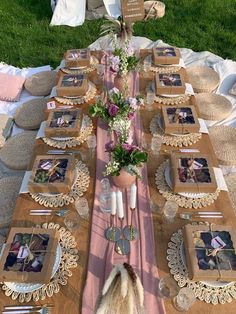 a table set up with pictures and flowers on it