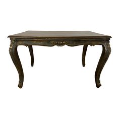 a wooden table with an ornate design on it's top and legs, against a white background