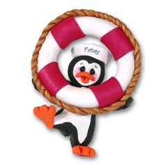 a toy penguin with a life preserver on it's back and feet in the air