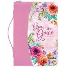 a pink bible cover with flowers and the words grow in grace written on it's side