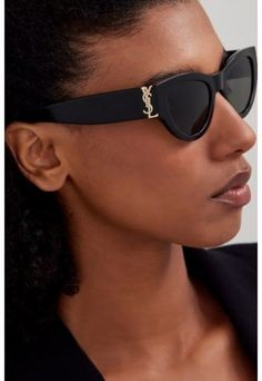 A STRONG FEMININE CAT-EYE SHAPE, THE EVOLUTION OF THE MONOGRAM ACETATE IN A BOLDER AND NEW ICONIC VERSION. THE MYTHIC YSL SIGNATURE IS INTEGRATED AS AN HINGE DETAIL AND MADE HIGHLY VISIBLE ON BOTH BOLD TEMPLES. Strong Feminine, Ysl Sunglasses, Saint Laurent Sunglasses, Eye Shape, Prescription Sunglasses, Eye Shapes, Eyeglasses For Women, Havana, Cat Eye Sunglasses