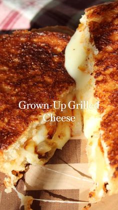 a grilled cheese sandwich cut in half on top of a paper plate with the words grown - up grilled cheese