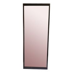 a tall mirror sitting on top of a white wall next to a black framed object