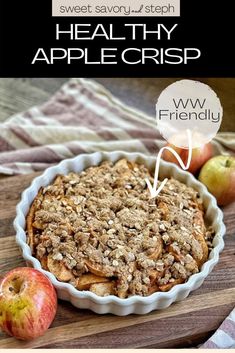 an apple crisp in a pie pan on top of a wooden cutting board