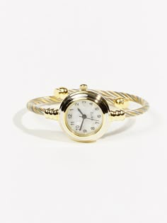 This stylish timepiece seamlessly blends multiple metals into an eye-catching design, creating a unique accessory that effortlessly complements any ensemble. Watch Ring, Trendy Watches, Round Watch, Fabric Bracelets, Tiny Rings, Cuff Watch, 2024 Christmas, A Million Dollars, Watches Women