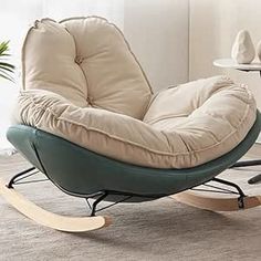 a rocking chair with a pillow on top of it