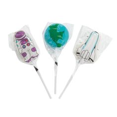 three lollipops are wrapped in cellophane